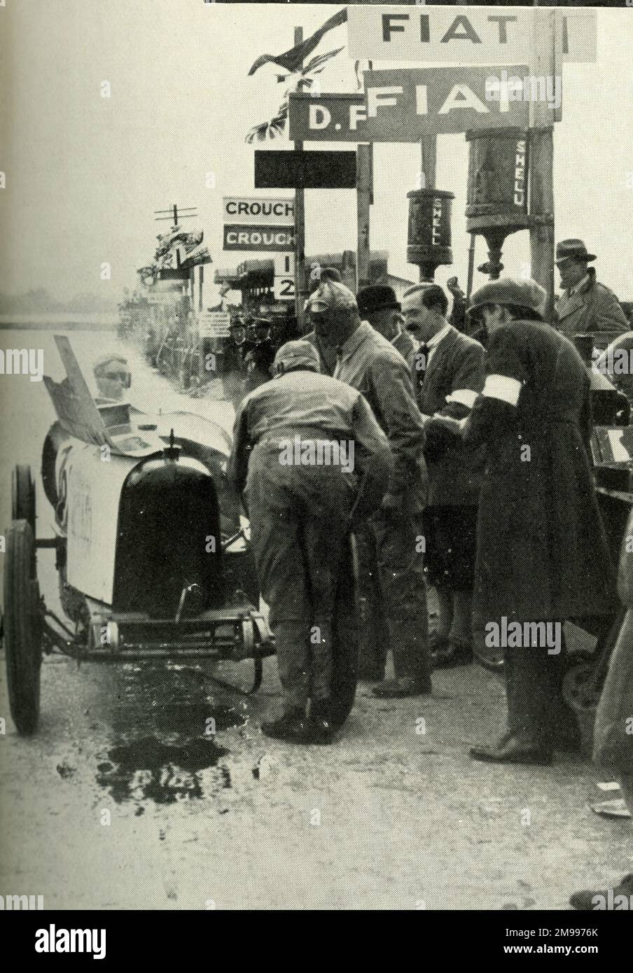 Sir Malcolm Campbell in his racing car at the Brooklands pits Stock