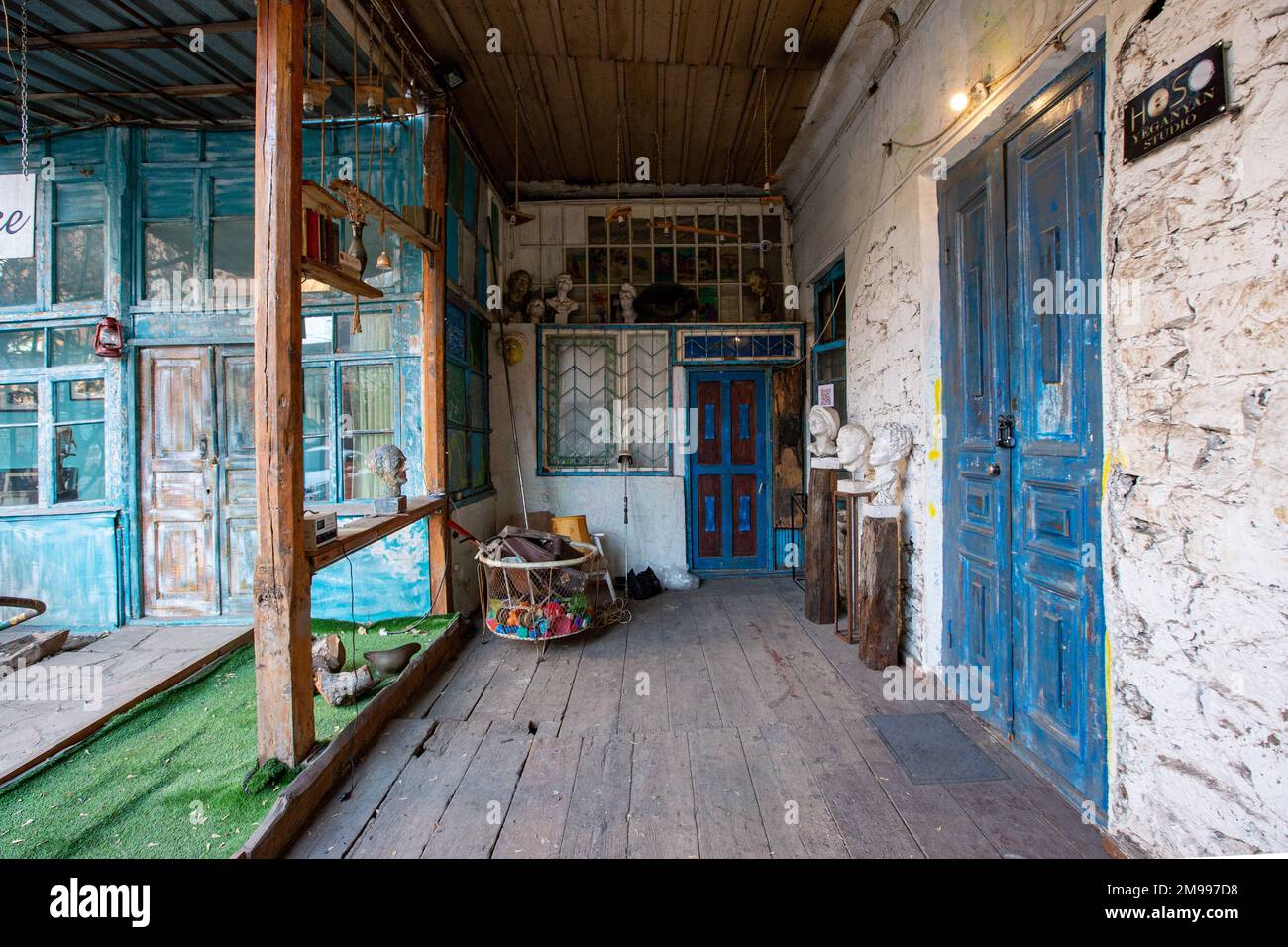 An old building facade with blue doors and sculptures in Yerevan Stock ...