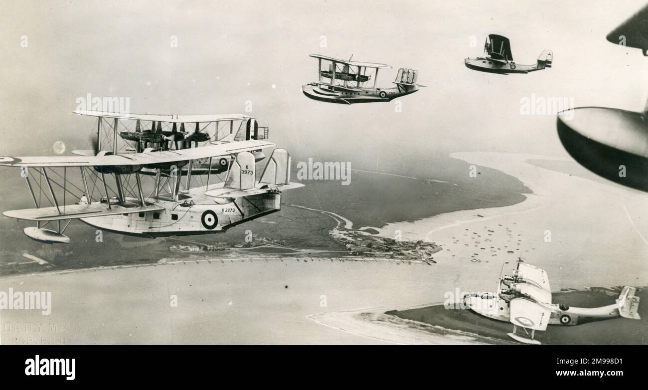 RAF flying boats over Felixstowe in June 1935 on their way to a fly-past at the RAF Display at Hendon. Clockwise from left: the first prototype Supermarine Stranraer, K3973; Short S14 Sarafand, S1589; Short S19 Singapore III, K4577; the first prototype Saunders-Roe A27 London, K3560; and Short S18 Knuckleduster, K3574. Stock Photo