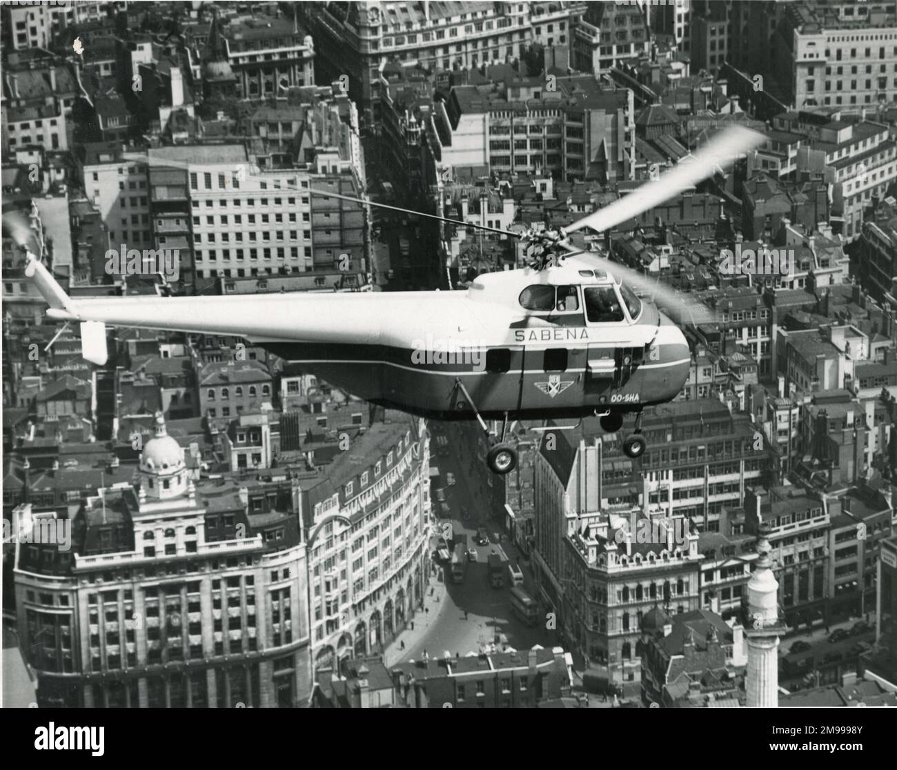 Sikorsky S-55, OO-SHA, of Sabena, over London (the Monument to the Great Fire of London is bottom right). Stock Photo
