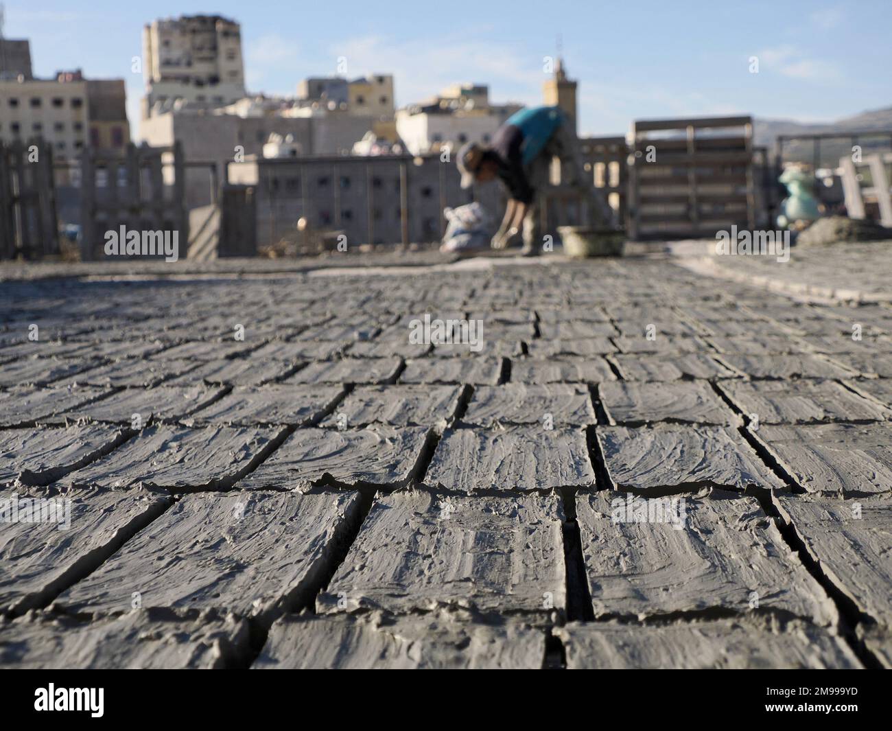 Craftsman painting and decorating ceramic products in pottery factory in Fez, Morocco, North