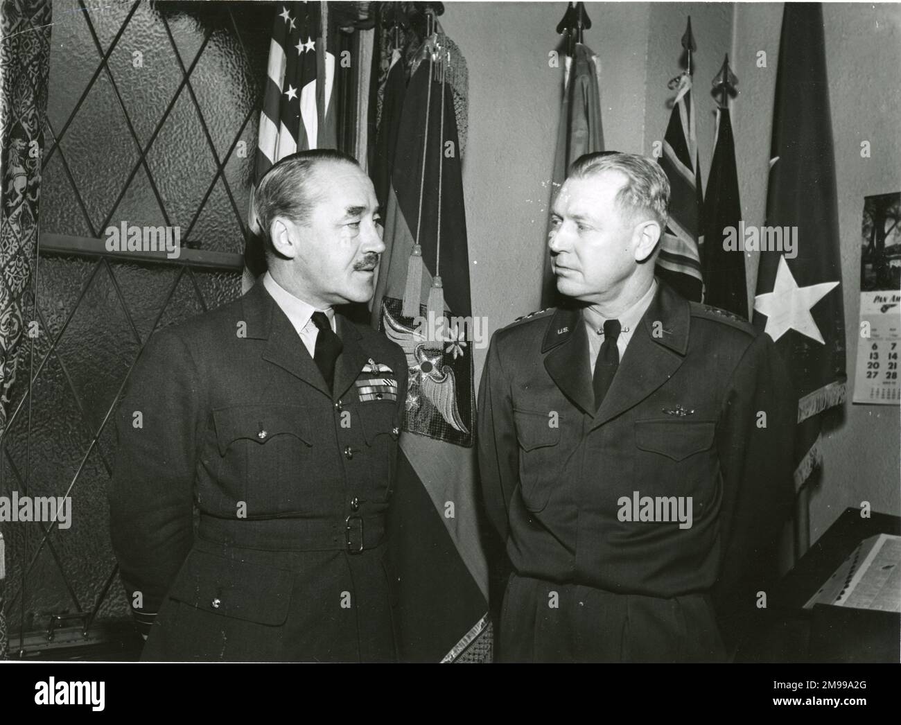 Air Marshal J.D.I. Hardman, OB, OBE, DFC, Chief of Air Staff, Royal Australian Air Force, called on General Weyland, Commanding General Far East Air Force, during a brief inspectional visit of Air Force installations in Japan and Korea. Photograph taken at Gen Weyland?s HQ in Tokyo. Stock Photo
