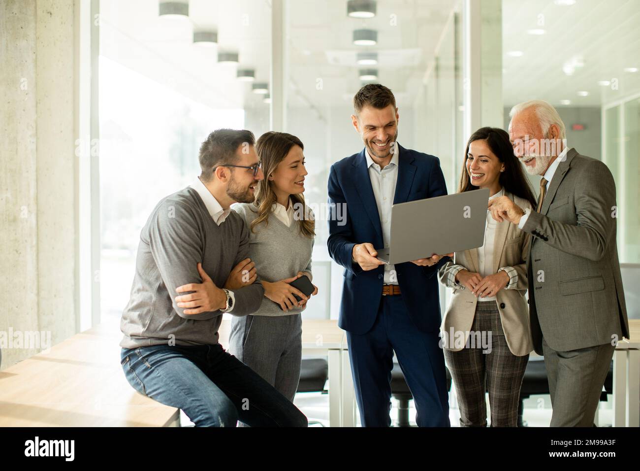 Group of businessmen and businesswomen working together in office Stock Photo