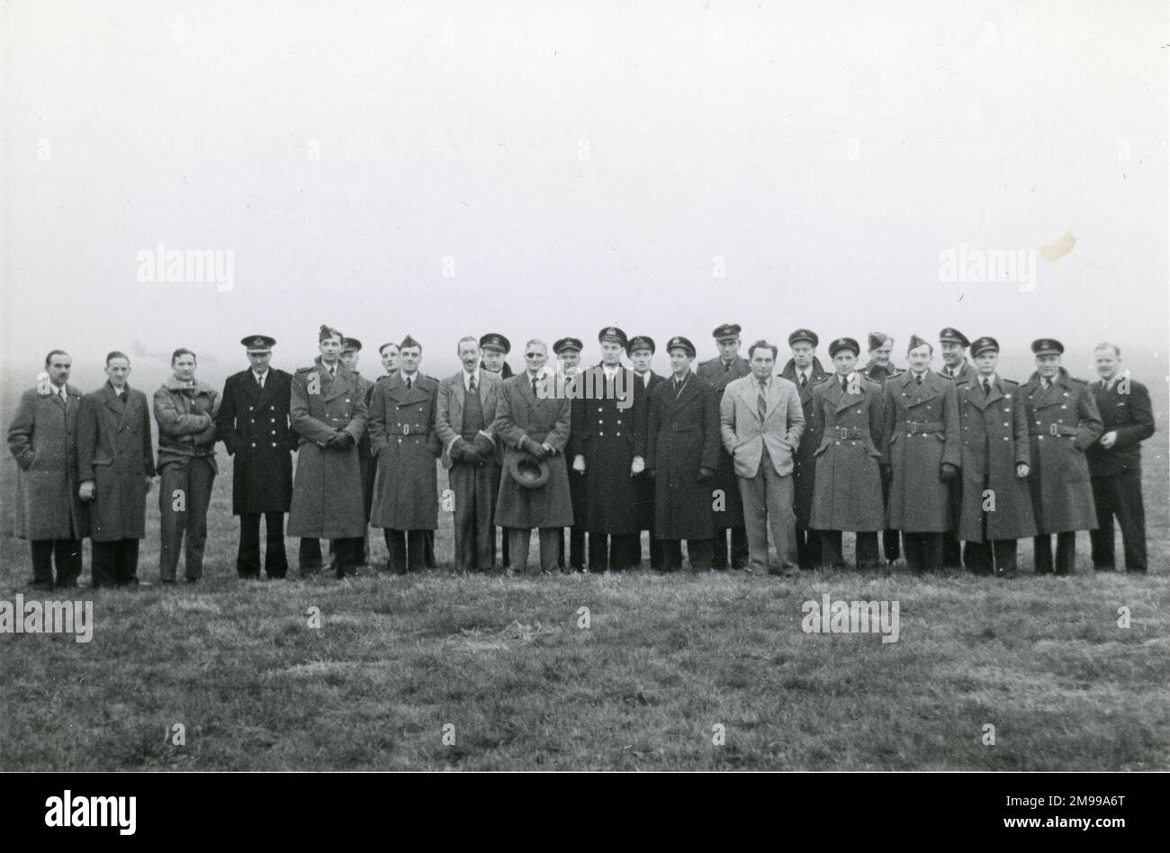 A section of the students and staff of the Empire Test Pilots? School during a visit to Rotol Ltd, Gloucester. Grp Capt S.R. Ubee, Commandant of the School, 11th from left; Lt Cdr W.F. Krantz, US Navy, 10th from left; and Flt Lt W.H. Scott, RAAF, 11 from right. Stock Photo