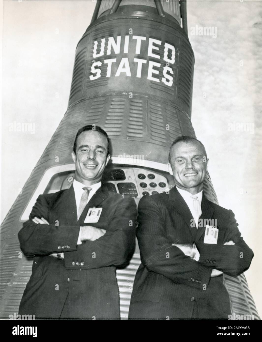 Malcolm Scott Carpenter, left, and John Glenn in front of a Mercury space capsule at Cape Canaveral after Glenn was named as the astronaut to make the first US orbital flight and Carpenter as his backup, 29 November 1961. Stock Photo