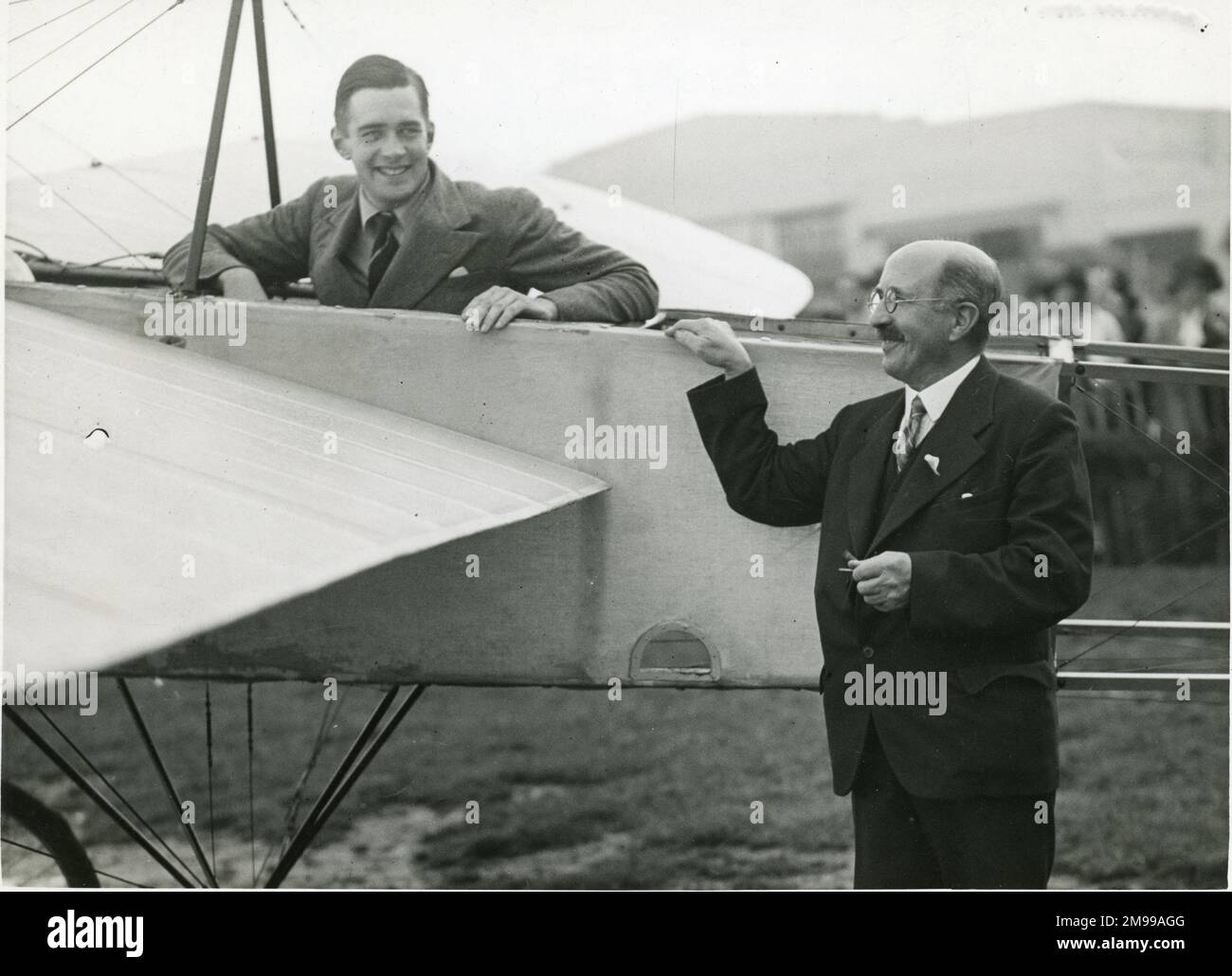 Richard Shuttleworth in the restored Bl‚riot with Mr A.E. Grimmer, its original owner, at London Aeroplane Club?s Garden Party, Hatfield, 12 September 1936. Stock Photo