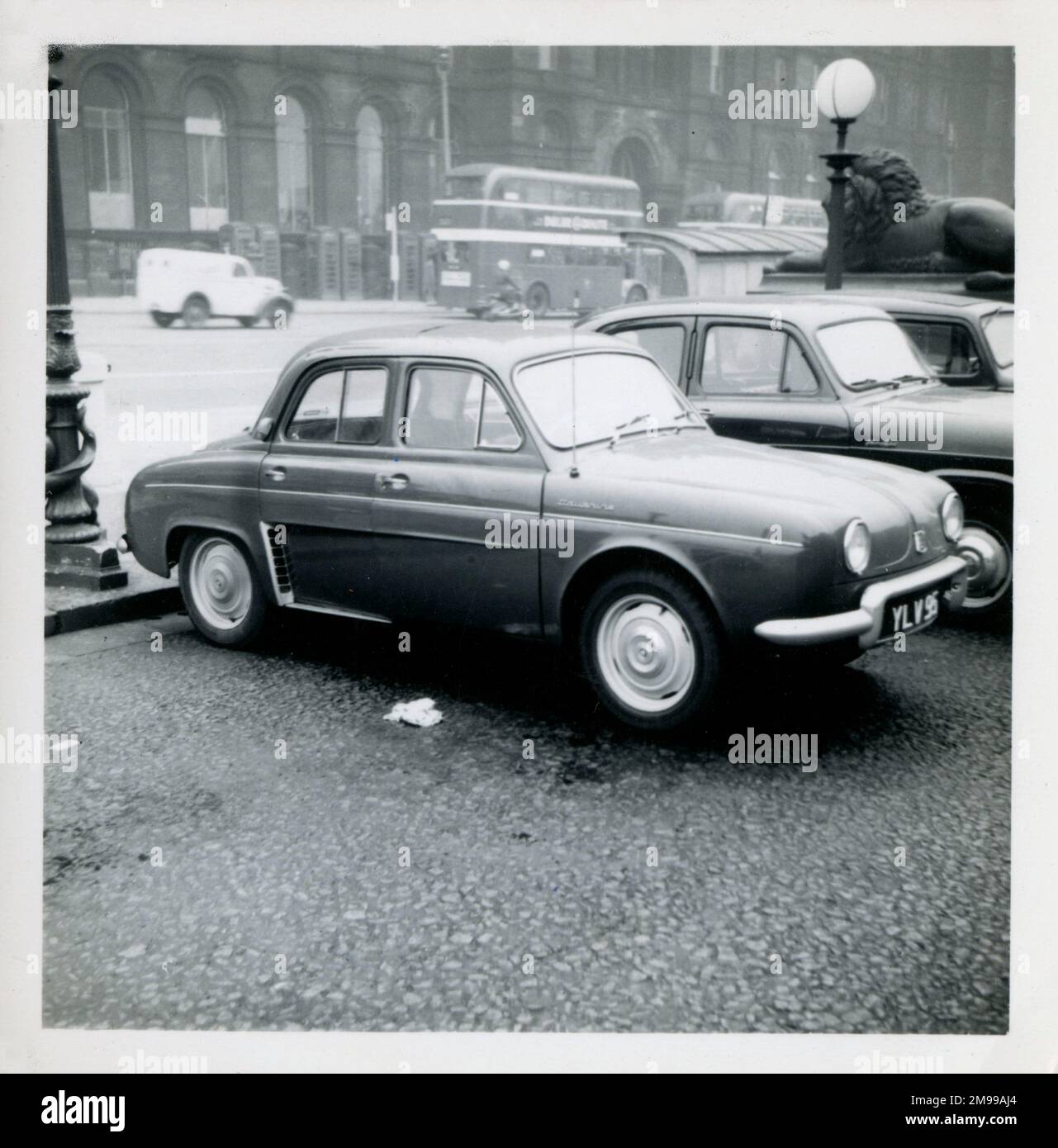 A lovely late 1950s Renault Dauphine parked outside St George's Hall, Liverpool on Lime Street. Stock Photo