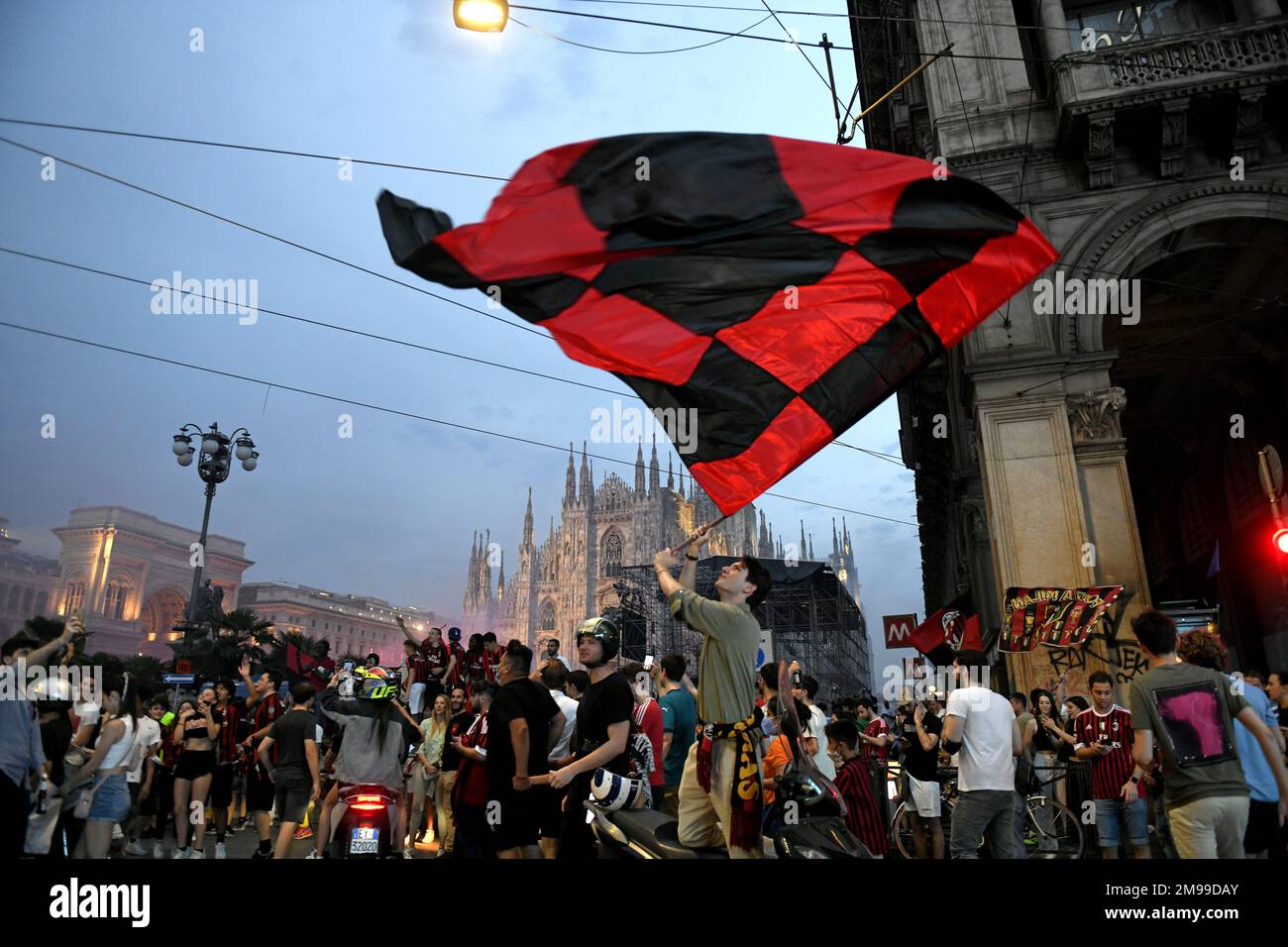 Milan-Italy May 22, 2022: AC Milan's football fans celebrate in Duomo's square after the win of the italian football league Serie A Stock Photo