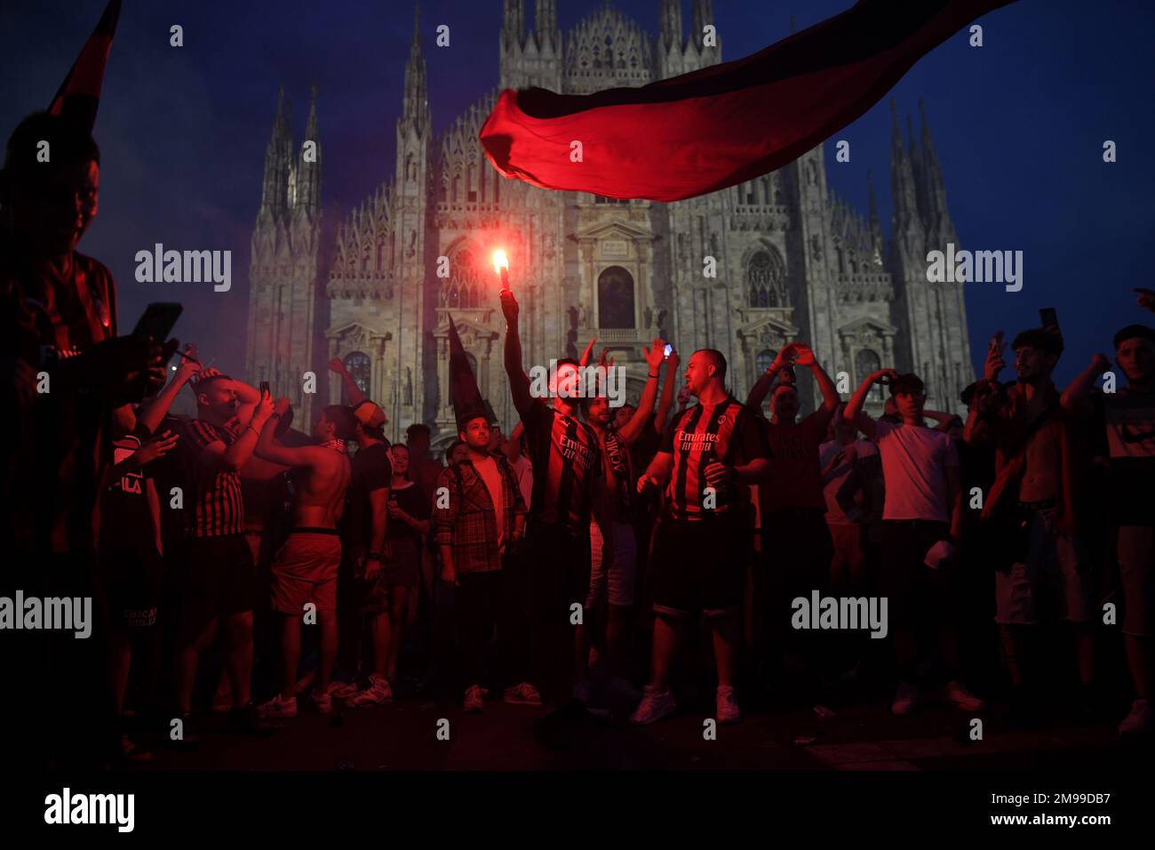 Milan-Italy May 22, 2022: AC Milan's football fans celebrate in Duomo's square after the win of the italian football league Serie A Stock Photo
