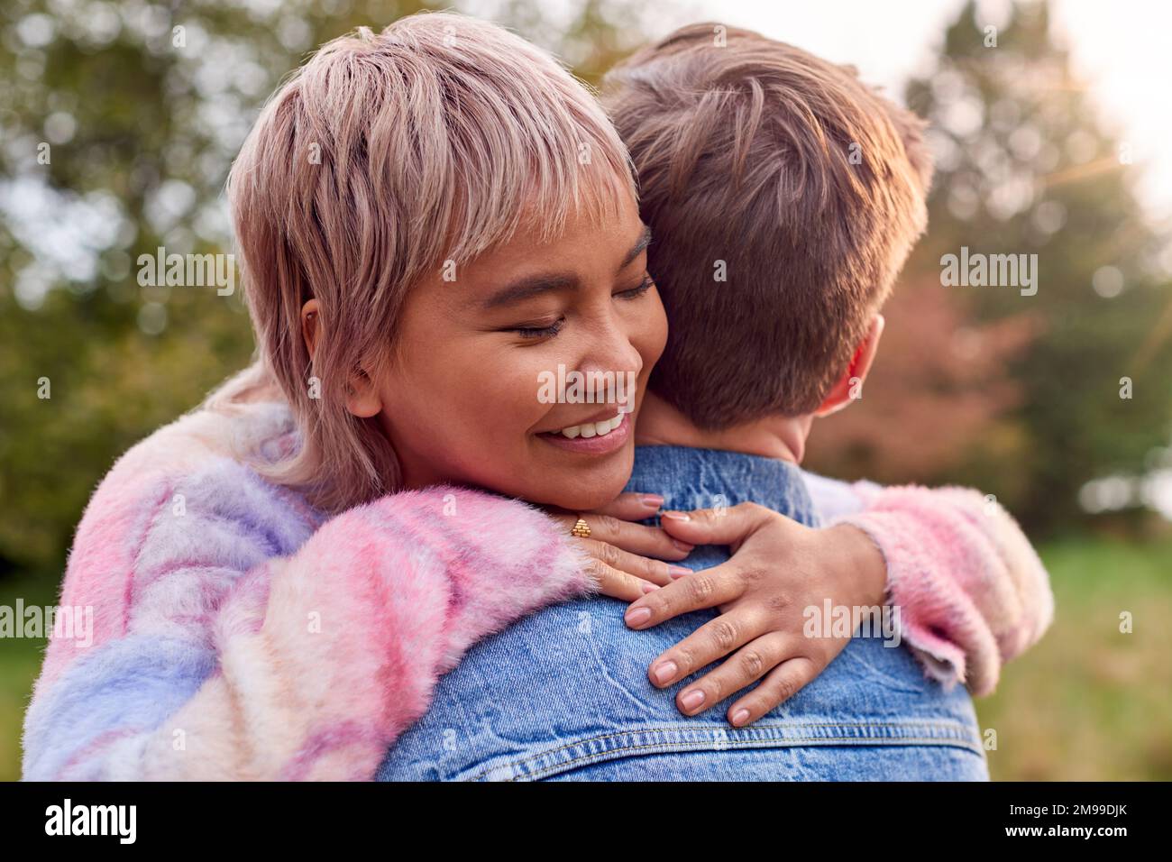HUG Couple hug nature are hi-res stock photography and images - Alamy