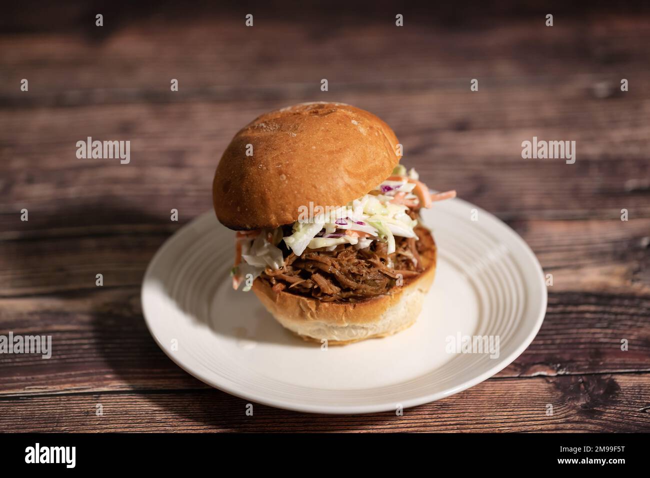 Pulled Pork Sandwish with Coleslaw on a plate Stock Photo