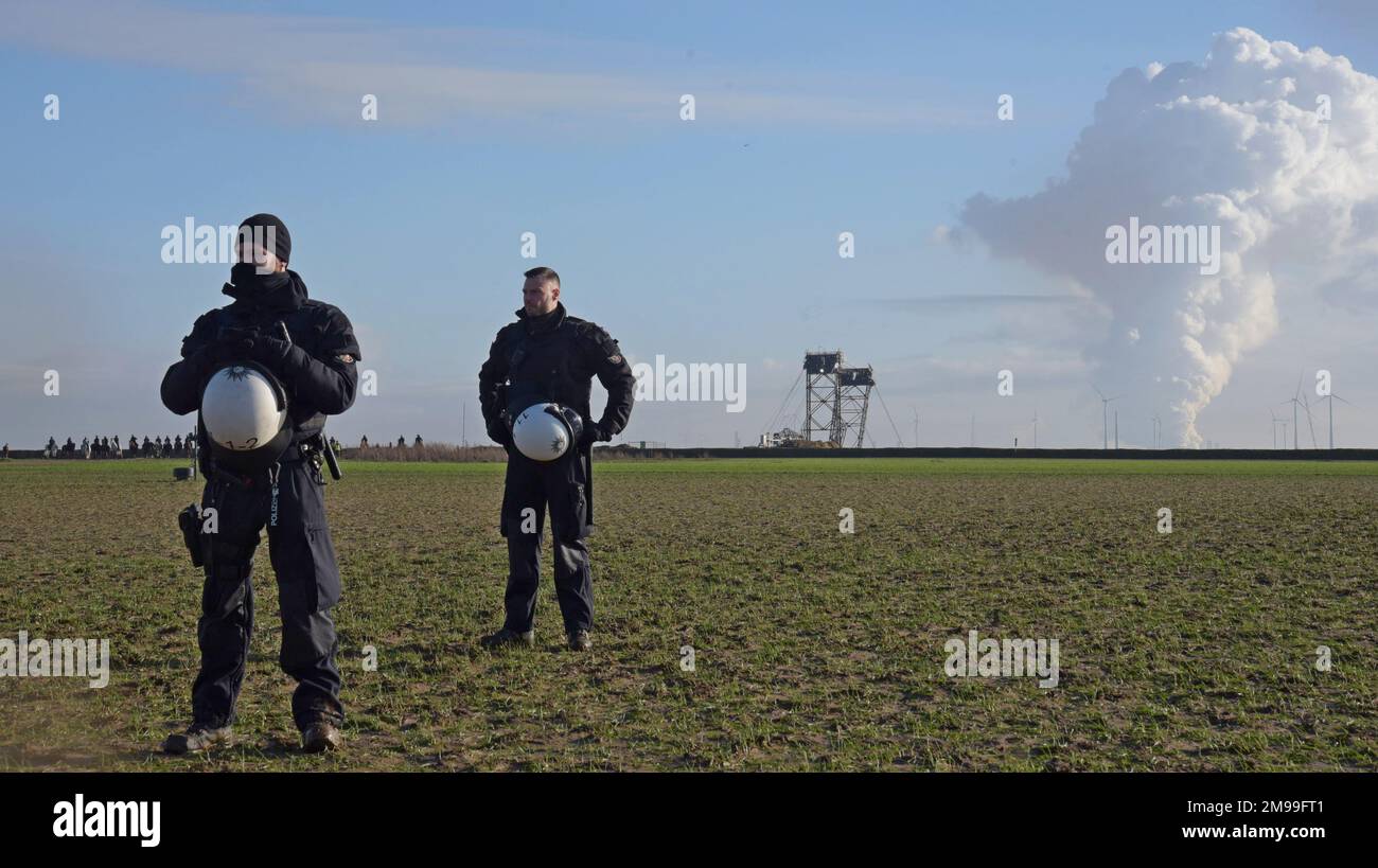 Lutzerath, Germany, 17th January 2023. Protests continued today at the Garzweiler open cast lignite mine site after the eviction of the occupied village of Lutzerath, which stands in the way of mine expansion. Activists carried out blockades on access roads and equipment. Mounted and foot police block access to the huge bucket wheel excavator that mines the site. G.P.Essex/Alamy Live News - Stock Image