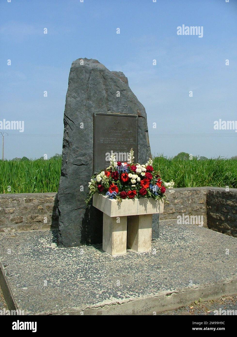 The Airfield was built by the 864th US Air Engineers Battalion & the Memorial was unveiled on 6 June 1989. The Franco-American 9th Airforce Normandy Airfields Association has marked all the 9th USAAF airstrips. Stock Photo