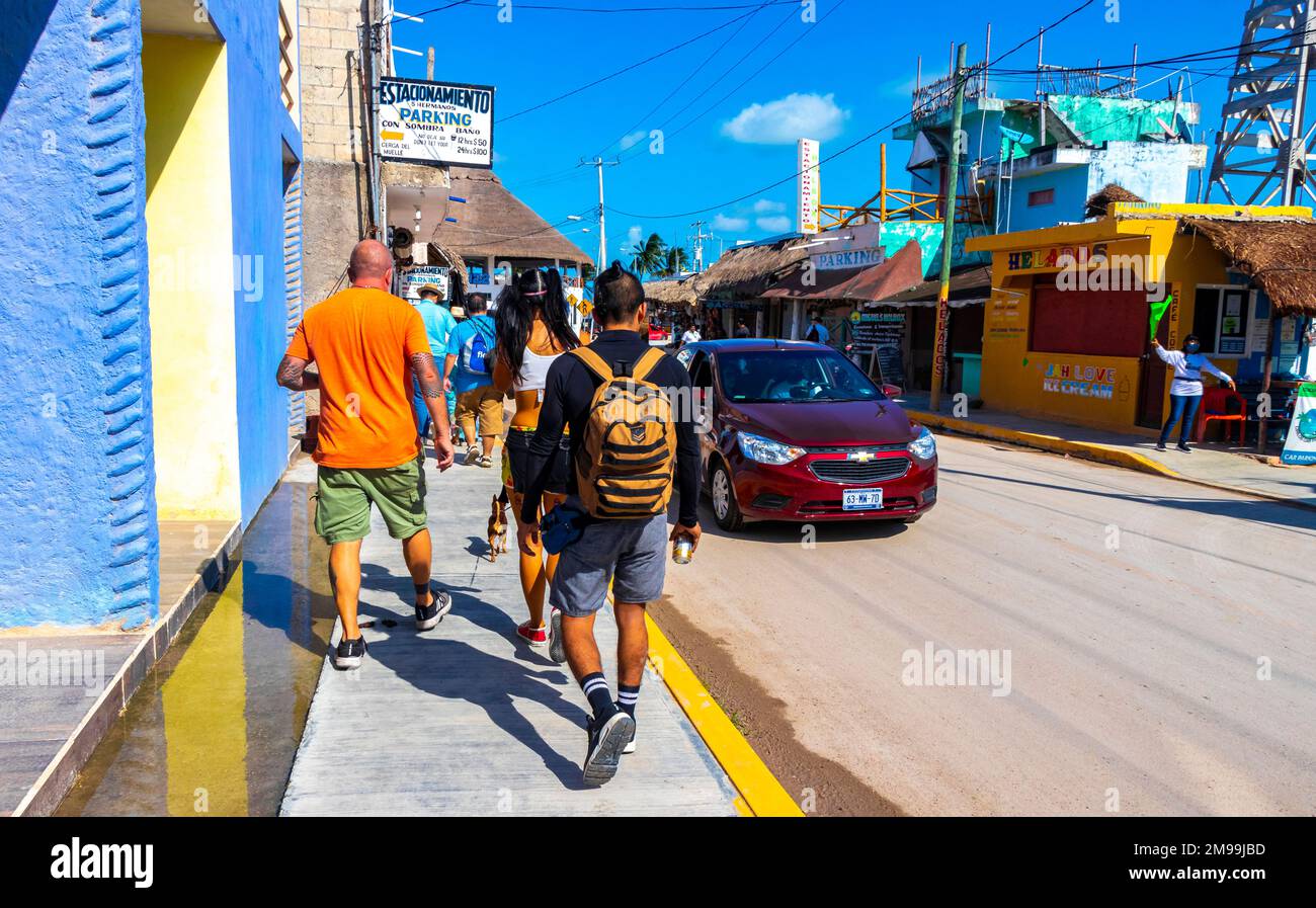 Small village place with port ferry road houses people and cars in