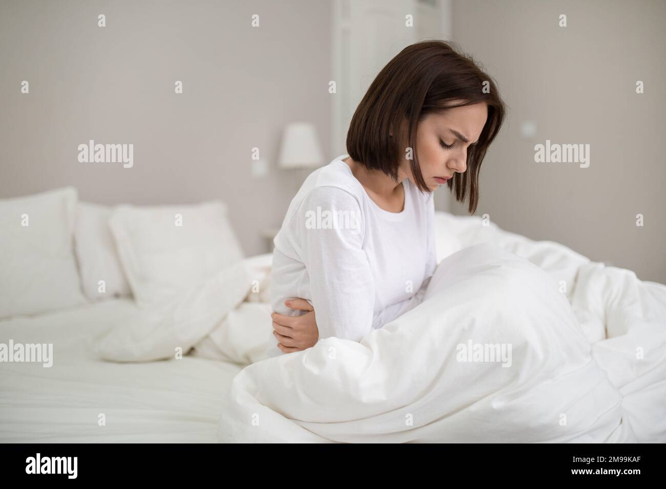 Woman 20s stomach pain hires stock photography and images Alamy