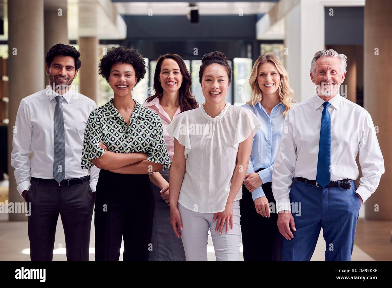 Smiling multi cultural business team hi-res stock photography and ...