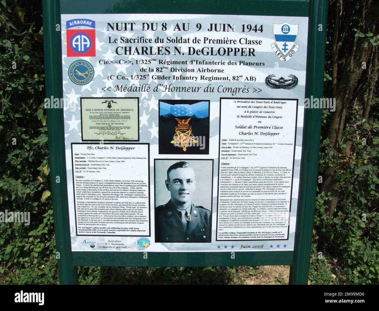 The board commemorates the actions of Private First Class de Glopper of 325th Glider Infantry  on 9 June 1944 during which he was killed. He is buried in Maple Grove Cemetery, Erie County, New York. Stock Photo
