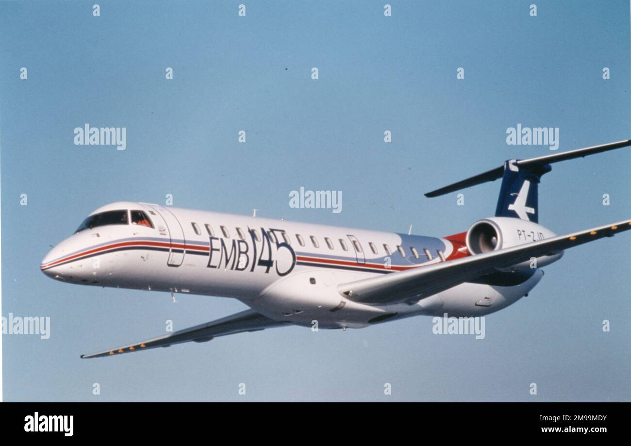 Embraer EMB-145, in-flight, side-on, (PT-ZJD?). Embraer S.A. is a Brazilian aerospace conglomerate that produces commercial, military, executive and agricultural aircraft and provides aeronautical services. Stock Photo