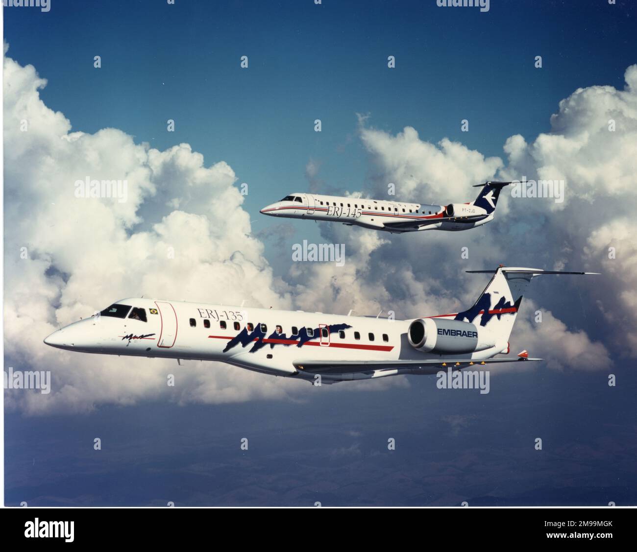 Embraer ERJ-135 and ERJ-145, in-flight, side-on, nose left. Embraer S.A. is a Brazilian aerospace conglomerate that produces commercial, military, executive and agricultural aircraft and provides aeronautical services. Stock Photo