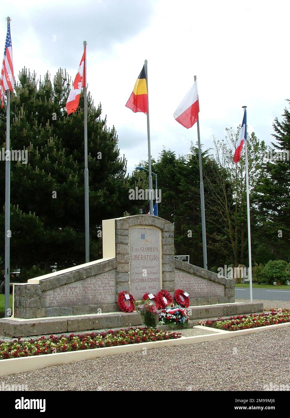 The Division landed on Gold Beach on D-Day, the leading Brigade was the 231st and one of the two  leading regiments was the 1st Battalion of the Dorsets, who came ashore just before 0730. There are other memorials in this area. This one is in the Place Alexander Stanier, named after the Commander of 231 Brigade. Stock Photo