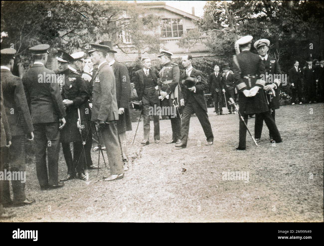 Reception in Embassy Grounds by H.R.H. The Prince of Wales at. Which each member of the British Aviation Mission was personally complimented by H.R.H.. William Francis Forbes-Sempill, 19th Lord Sempill AFC, AFRAeS (1893-1965) was a Scottish peer and record-breaking air pioneer who was later shown to have passed secret information to the Imperial Japanese military before the Second World War. In 1921, Sempill led an official military mission to Japan that showcased the latest British aircraft. In subsequent years he continued to aid the Imperial Japanese Navy in developing its Navy Air Servic Stock Photo