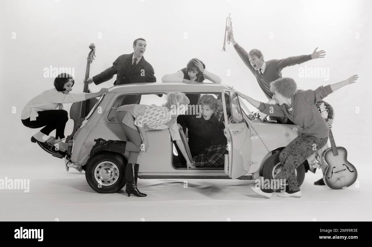 Advertisement for CPV (Colman Prentis & Varley) - group of Beatniks (some holding musical instruments!) trying to squeeze into an Austin A7 (4/4). Stock Photo