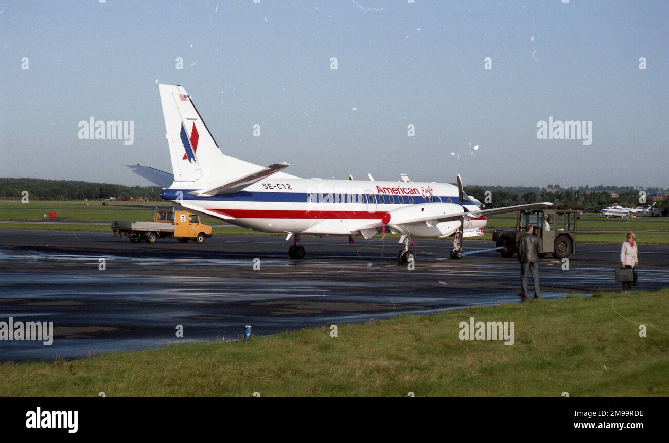 Farnborough 92 - American Eagle SAAB 340B - SE-C12. A fresh off the production line SAAB 2000 prior to delivery to American Eagle, still bearing the secondary registration of SE-C12. Stock Photo