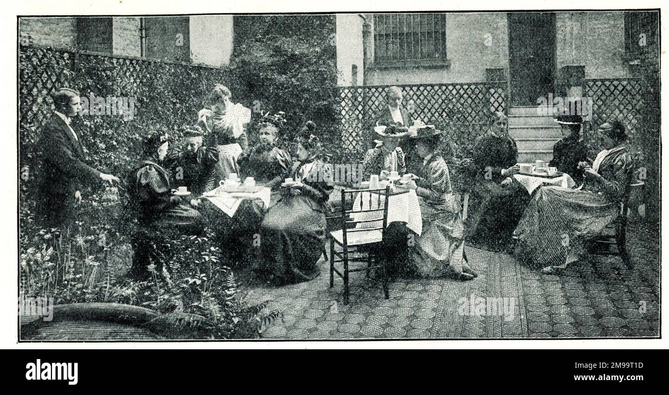 Afternoon tea in the garden of the Pioneer Club - The Ladies' Clubs of London. Stock Photo