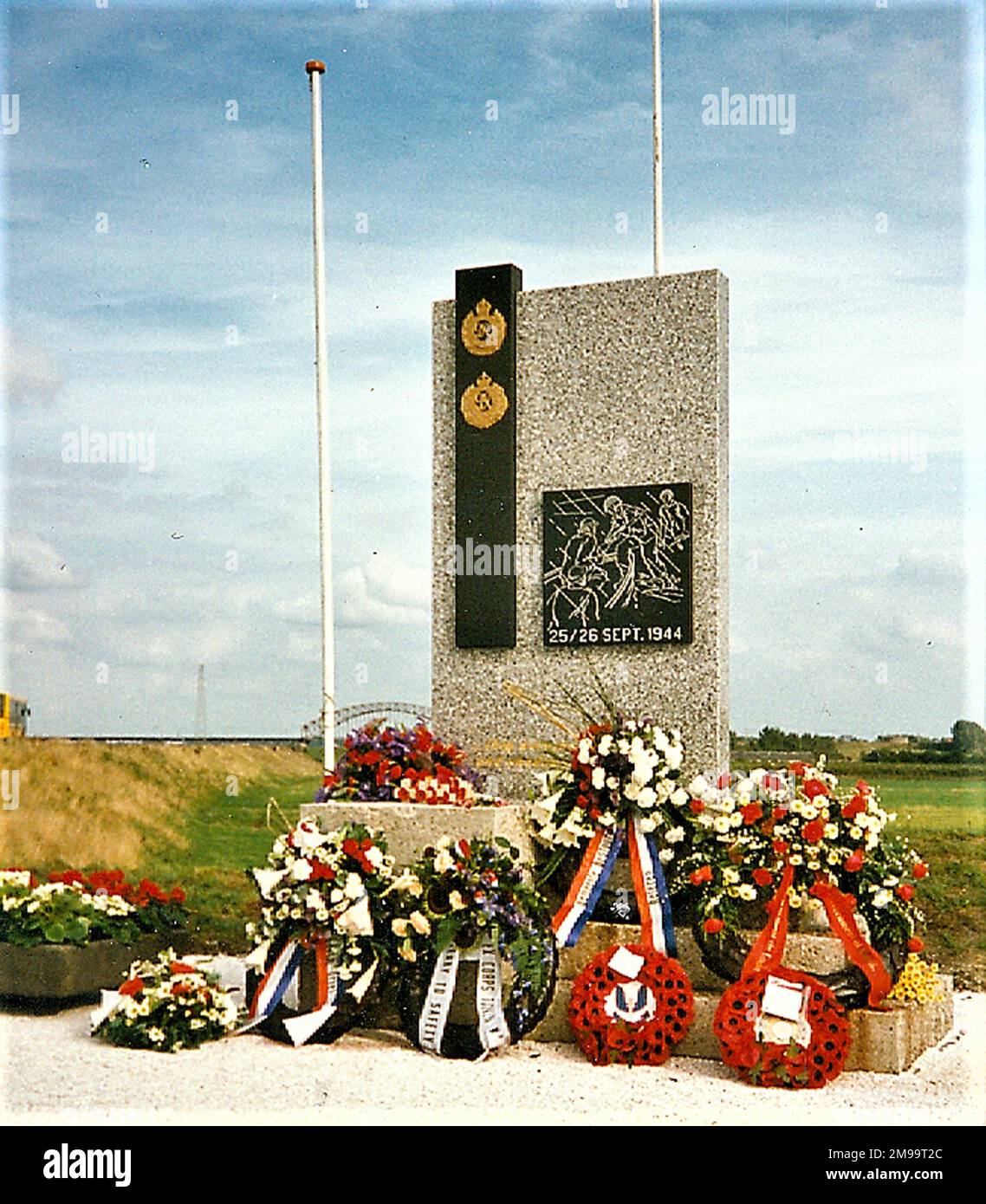 In the final days of Operation Market Garden, the beleagured British forces left north of the Rhine at Oosterbeek, west of Arnhem, were evacuated across the river in an way that smacked strongly of the British withdrawal from Gallipoli during WW1. In an evacuation named 'Berlin', dozens of crossings were made in small boats by British and Canadian Engineers under heavy German fire. Over 2,000 troops were rescued between around 2200 hours on the 25th and 0545 hours on the 26th of September 1944. They landed in the area where the Monument stands. It is of polished granite and shows the badges Stock Photo