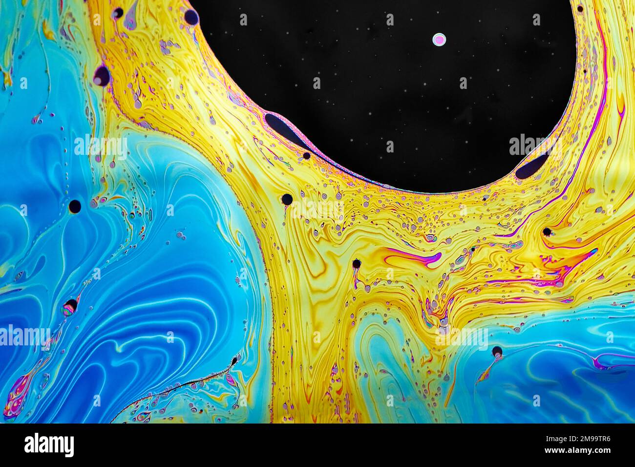Amazing inflorescent colors are created by the light on a soap bubble