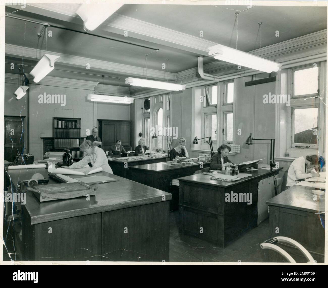 The Drawing Office, 3rd Floor IMechE. Later in c1936 the opposite end was partitioned off as an office. In 1951 the office was transferred to the door-end and re-partitioned. Stock Photo