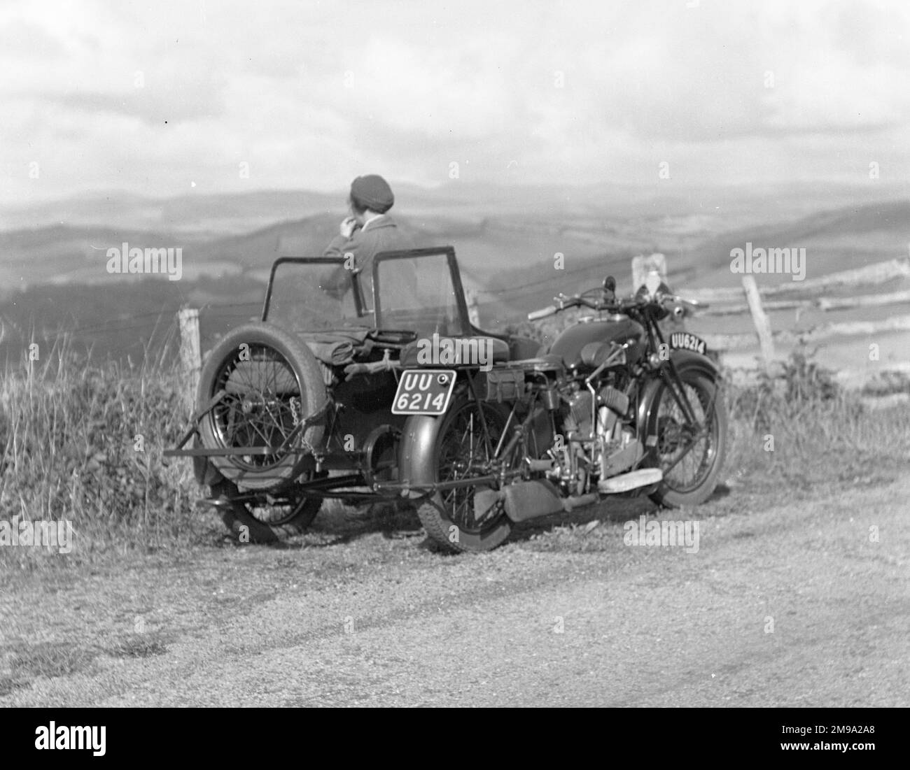 A.J.S. Motorcycles M1 (de-luxe) or  M2 (standard) 996cc V-twin with sidecar, from 1929 (M series), somewhere in Wales enjoying the view. In 1929 the M1 and M2 sold for sold for lb76.10s.0d. and lb66 respectively. See: http://www.historywebsite.co.uk/Museum/Transport/Motorcycles/ajs4f.htm Stock Photo