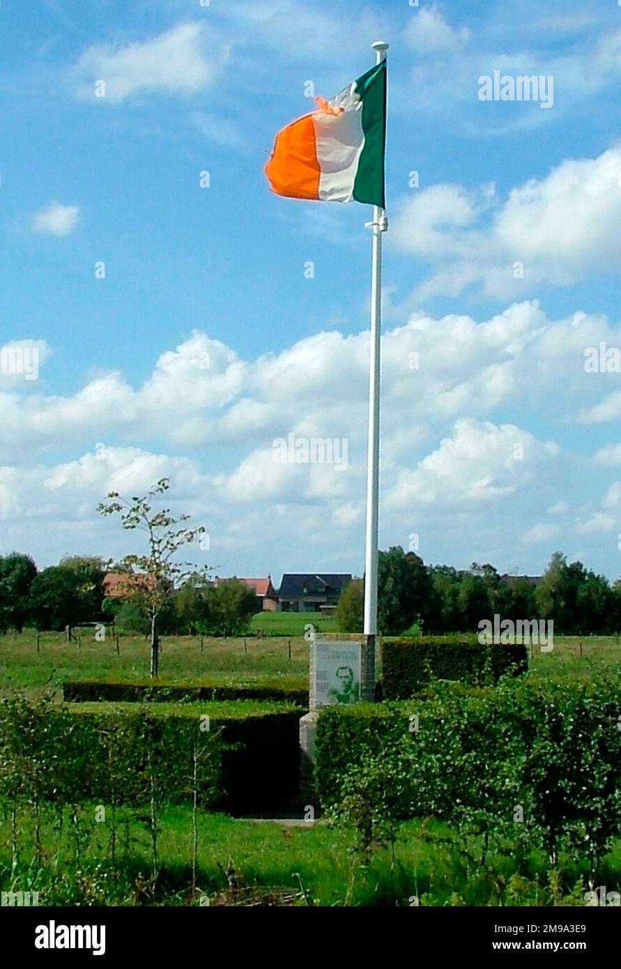 The memorial, mounted on a brick plinth, carries a photo of the poet. Beside it the Irish flag flies, there is an information board and behind is an apple tree planted in his memory on 27 March 2010. A signed route, The Ledwidge Route on the Writers Path, follows the old railway line that runs nearby. Stock Photo