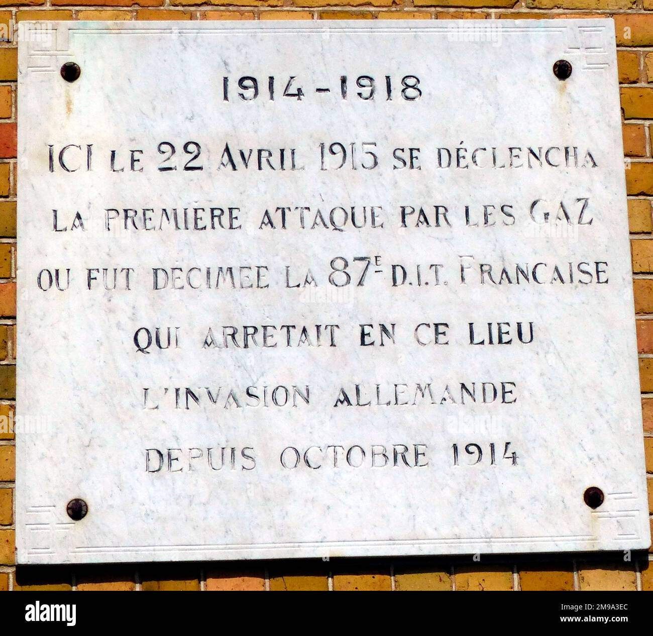 This is to the French 87th Territorial Infantry Division and is on the wall of Langemarck Town Hall. Stock Photo