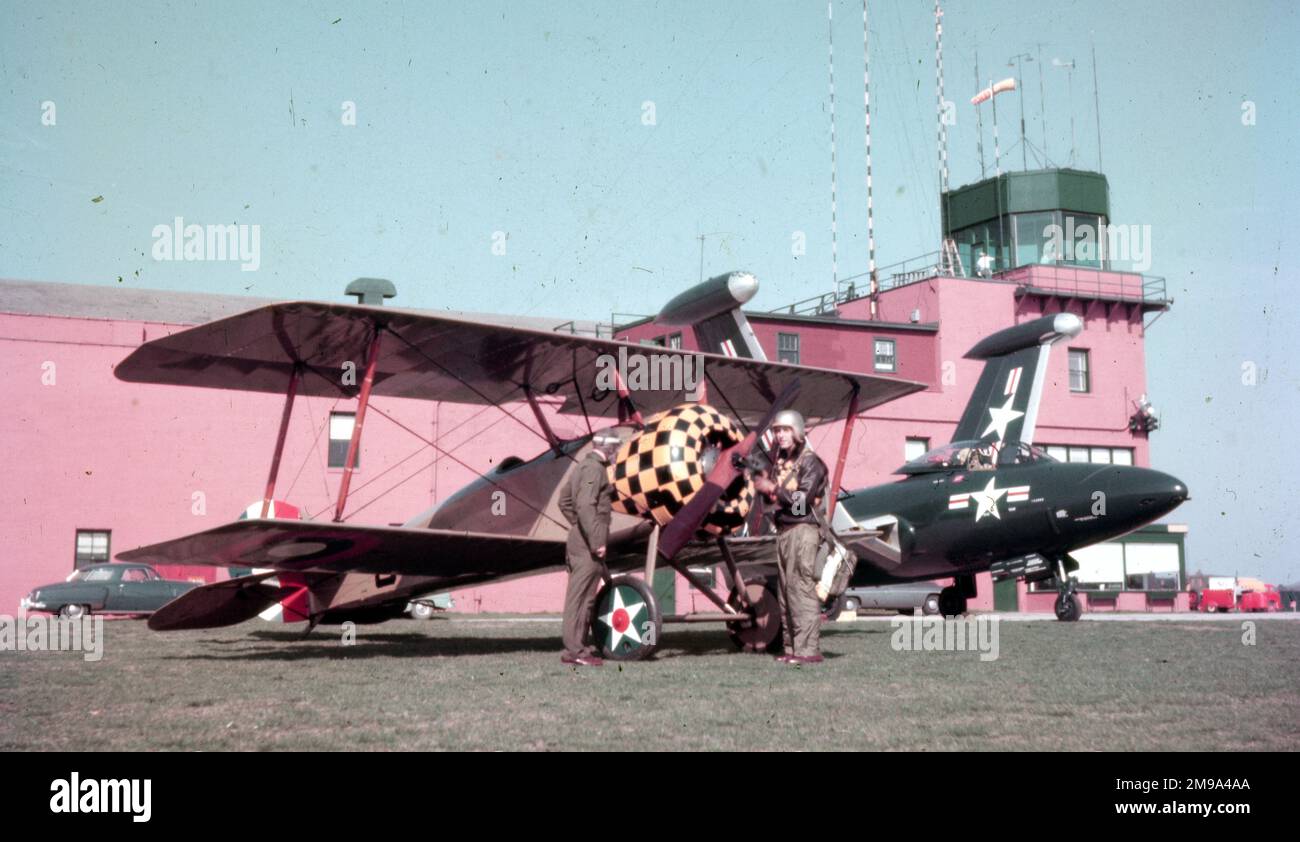 1955 United States Navy meets 1918 United States Army Air Service. A USAAS Thomas-Morse S-4C parked next to a US Navy Grumman F9F-5 Panther Stock Photo