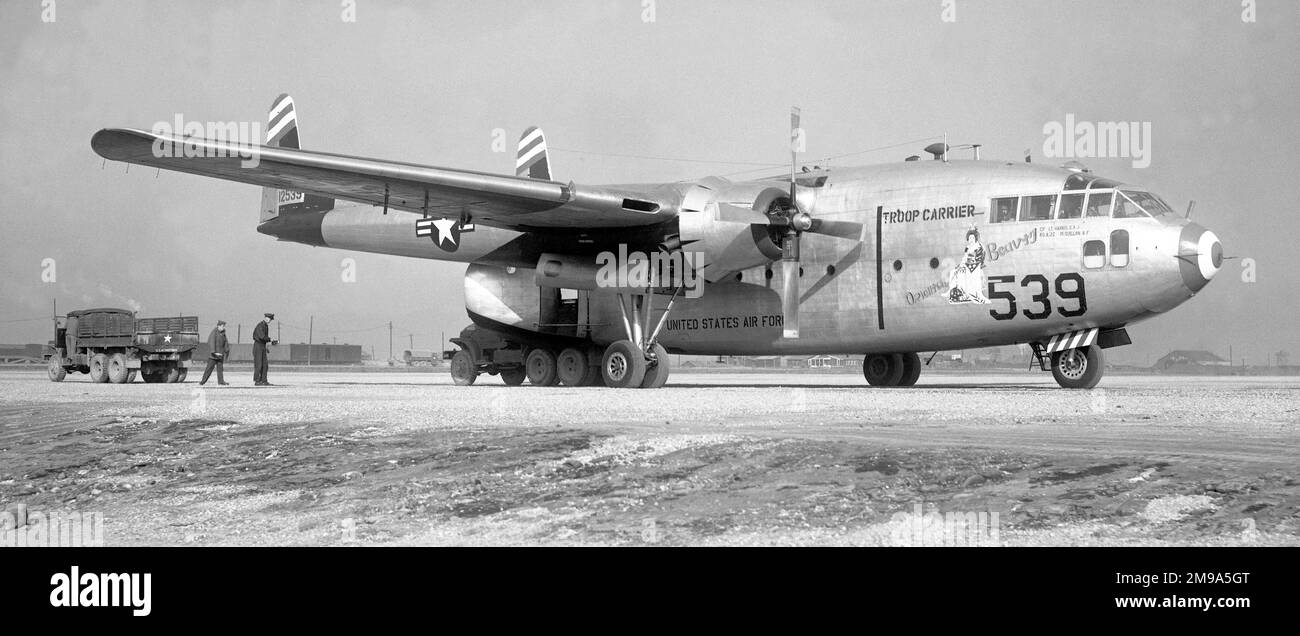 United States Air Force - Fairchild C-119C-22-FA 53-2539 ORIENTAL BEAUTY (msn 10497) ; of the 817th Troop Carrier Squadron, 403rd Troop Carrier Group, 483rd Troop Carrier Wing, at Camp Page (K-47 air base, Chunchon), unloading lettuce. Project Ironage; 2539 was loaned to and flown by the Armee de lAir in French Indochina in French Air Force colors; returning to the 356th Troop Carrier Squadron, 907th Troop Carrier Group. Disposed of to MASDC on 4 December 1965 and declared excess on 6 May 1968. Stock Photo