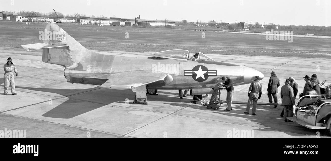 Grumman XF9F-2 Panther 122475 (Model G-79, 1st prototype), at the Naval Air Testing Centre on Patuxent River Naval Air Station in Maryland, with Grumman test pilot Corky Meyer (Corwin H. Meyer) walking under the tail of the aircraft. First flown on 21 November 1947 by Corky Meyer, powered by a Rolls-Royce Nene. Stock Photo