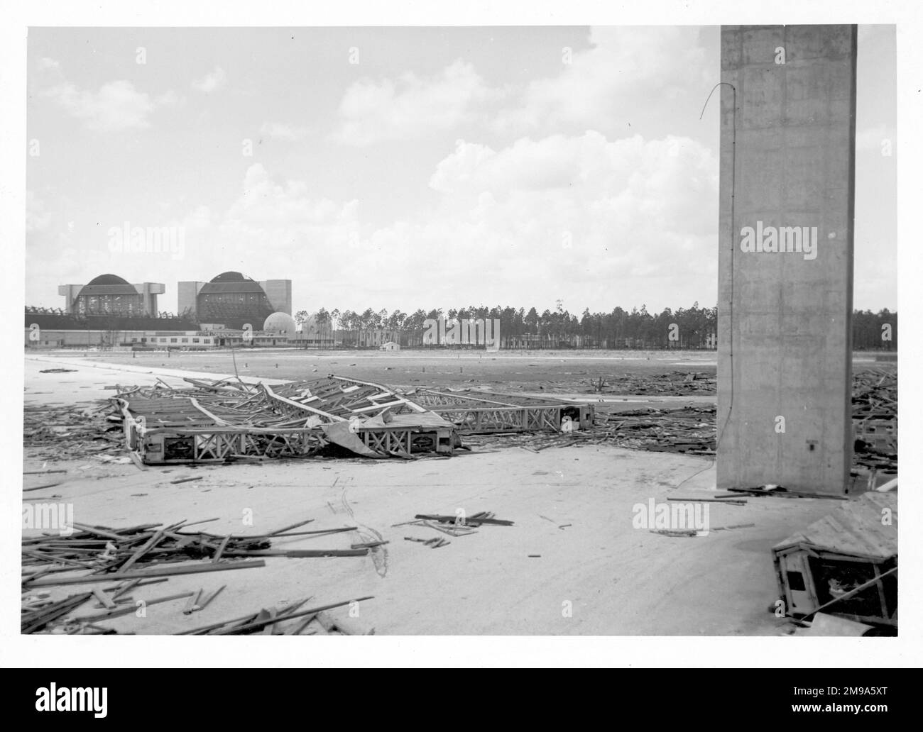 United States Navy - Richmond Naval Air Station (Richmond NAS), just west of Miami, showing the destroyed, huge, airship hangars which burnt down during Hurricane Nine on 15 September 1945 (three years, to the day, after the air station was commissioned). The hurricane ignited a fire in an adjacent building which spread to Three Airship hangars destroying 25 blimps, 366 airplanes, and 150 automobiles which were stored inside for shelter from the storm, which was also known as the 1945 Homestead hurricane. Stock Photo
