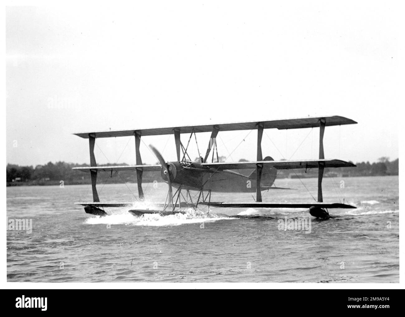 One of three Curtiss Model L2 (aka Model 9) floatplanes, taxiing on