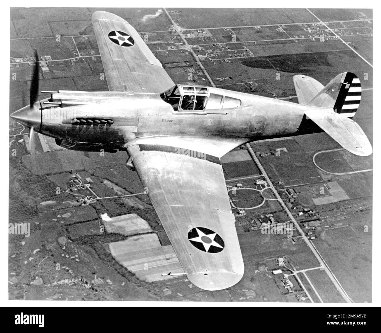 United States Army Air Corps (USAAC) - Curtiss P-40 (Model 81). The first production standard, delivered with the stars and stripes on both wings, unusually. This could possibly be the XP-40 (Model 75P, msn 12424) in its third iteration as the production standard for the P-40 (Model 81). Stock Photo