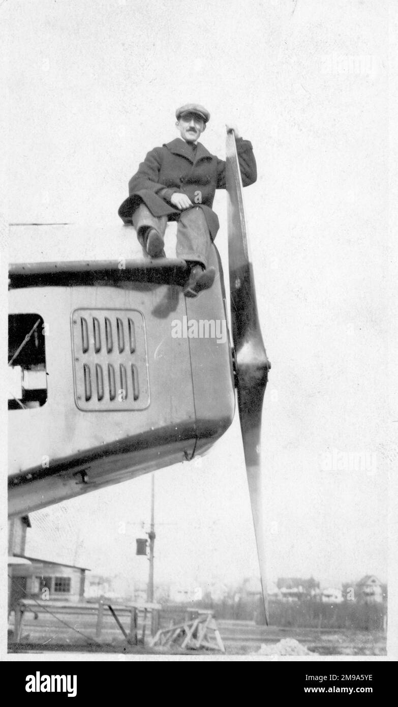 A worker sat on a Liberty engine nacelle of Engineering Division XNBL-1 AS64215, (also known as The Barling Bomber and Witteman-Lewis XNBL-1 and McCook Field Project P-303), during manufacture at Witteman-Lewis Co. Designed by Walter Barling, the XNBL-1 (NBL=Night Bombardment-Long distance) was a large triplane, powered by six 420hp Liberty L-12 engines, quad landing gear and four tails. Contracted to Witteman-Lewis Co for manufacture at Hasbrouck Heights, it was shipped by train, unsassembled, in sections, to Wright Field. First flown on 22 August 1923, it was only a few times before it was Stock Photo