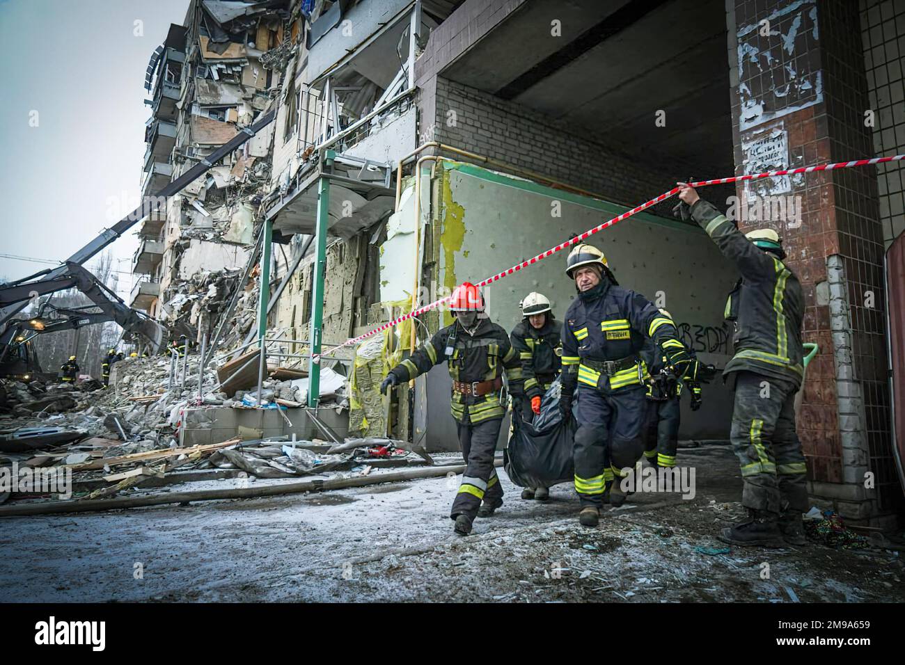 Brave rescuers of the State Emergency Service of Ukraine search through the rubble of an apartment building in Donipro, Ukraine in the aftermath of a Russian missile strike . Photo: State Emergency Service of Ukraine Stock Photo