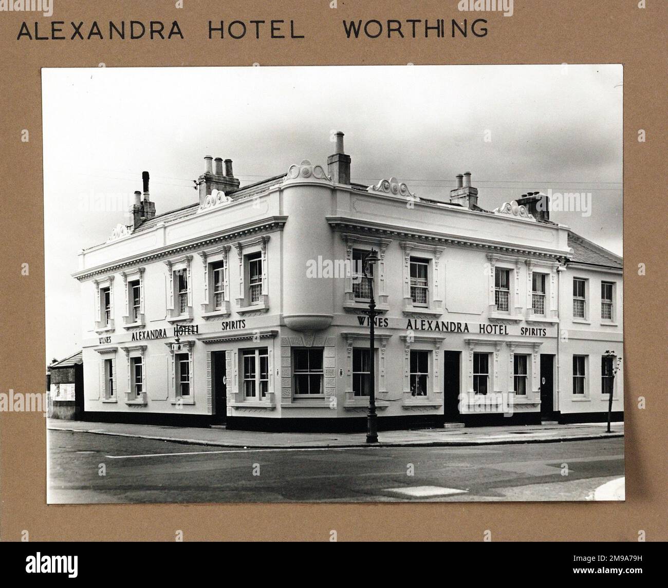 Photograph of Alexandra Hotel, Worthing, Sussex. The main side of the print (shown here) depicts: Corner on view of the pub.  The back of the print (available on request) details:  Nothing for the Alexandra Hotel, Worthing, Sussex BN11 2DF. As of July 2018 . Renamed The Alex now Alexandra . Punch Taverns Stock Photo