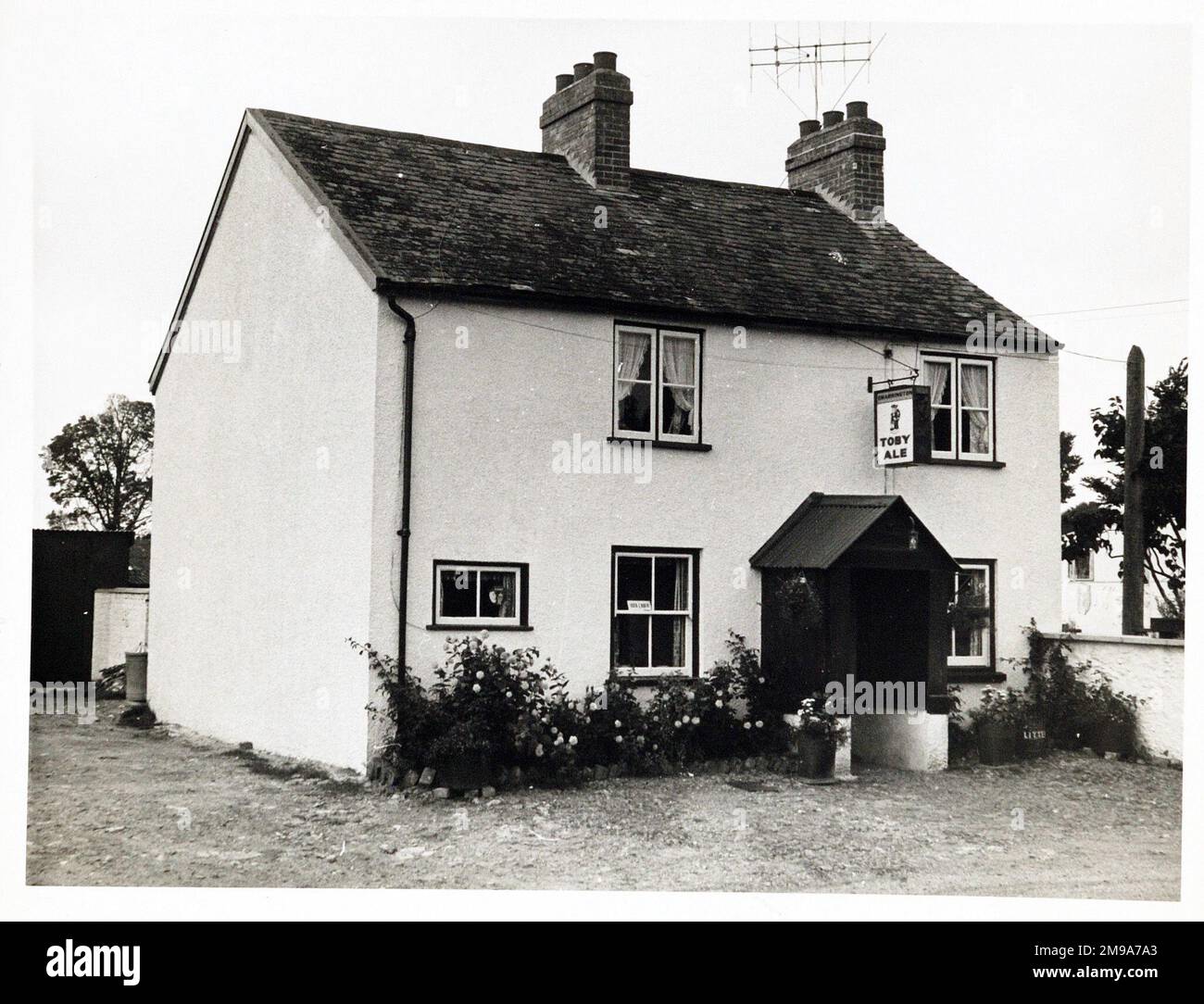 Photograph of Alfington Inn, Ottery St Mary, Devon. The main side of the print (shown here) depicts: Left Face on view of the pub.  The back of the print (available on request) details: Publican ID for the Alfington Inn, Ottery St Mary, Devon EX11 1NZ. As of July 2018 . Now in residential use Stock Photo