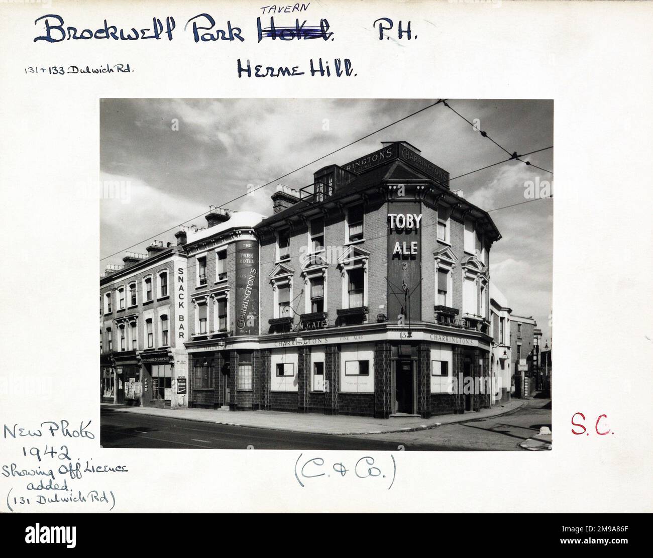 Photograph of Brockwell Park Tavern , Herne Hill, London. The main side of the print (shown here) depicts: Corner on view of the pub.  The back of the print (available on request) details: Trading Record 1932 . 1961 for the Brockwell Park Tavern, Herne Hill, London SE24 0NG. As of July 2018 . Now Florence aka Stakeline . Metropolitan (Greene King) Stock Photo