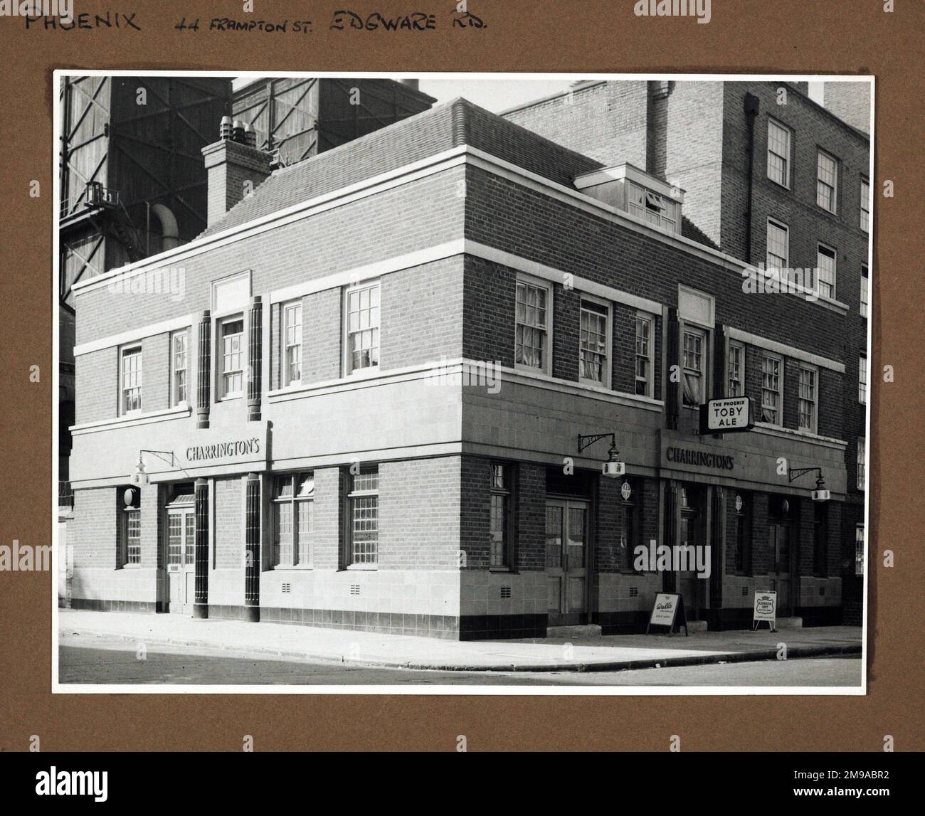 Photograph of Phoenix PH, Edgware, London. The main side of the print (shown here) depicts: Corner on view of the pub.  The back of the print (available on request) details: Nothing for the Phoenix, Edgware, London NW8 8LE. As of July 2018 . Closed and replaced with flats Stock Photo