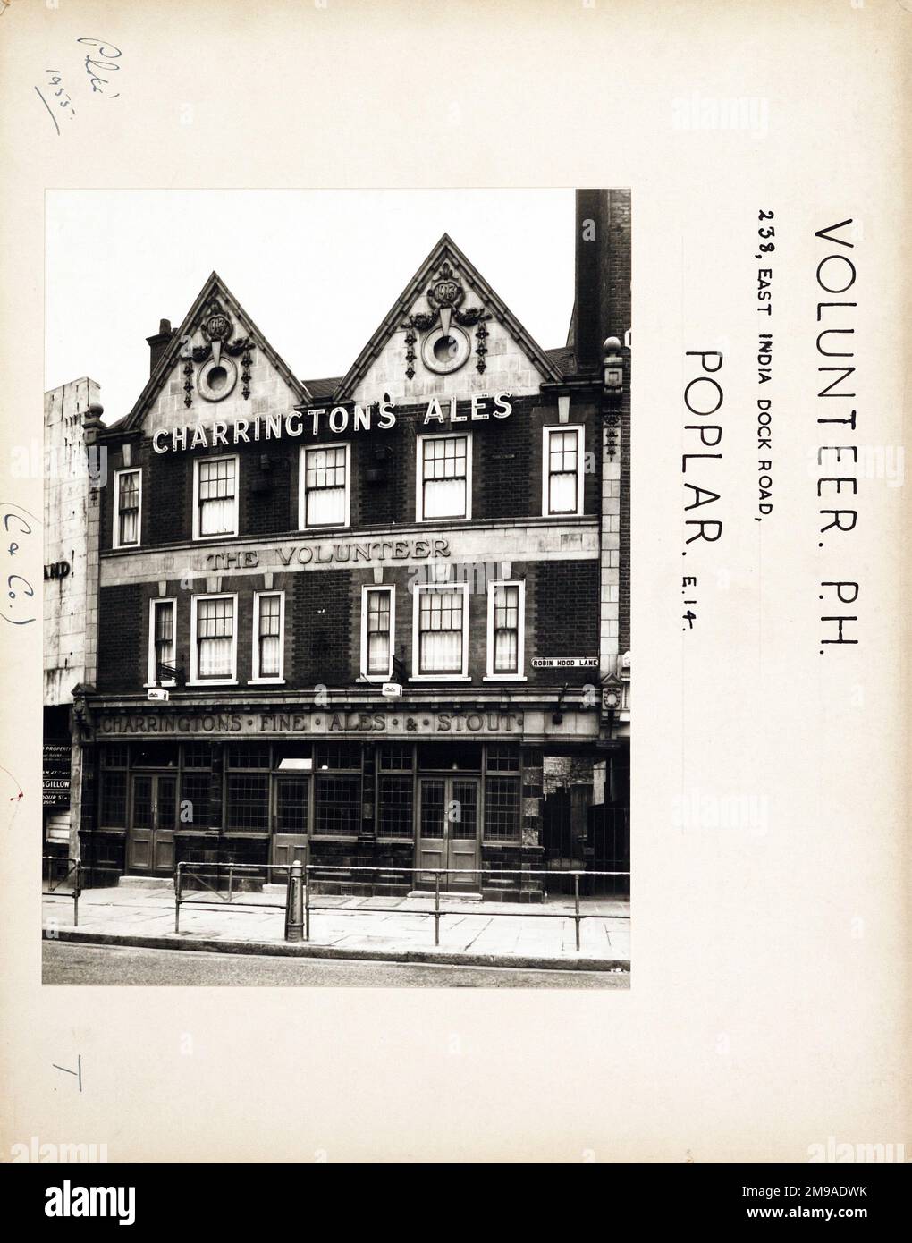 Photograph of Volunteer PH, Poplar, London. The main side of the print (shown here) depicts: Face on view of the pub.  The back of the print (available on request) details: Trading Record 1939 . 1961 for the Volunteer, Poplar, London E14 0EG. As of July 2018 . Demolished Stock Photo