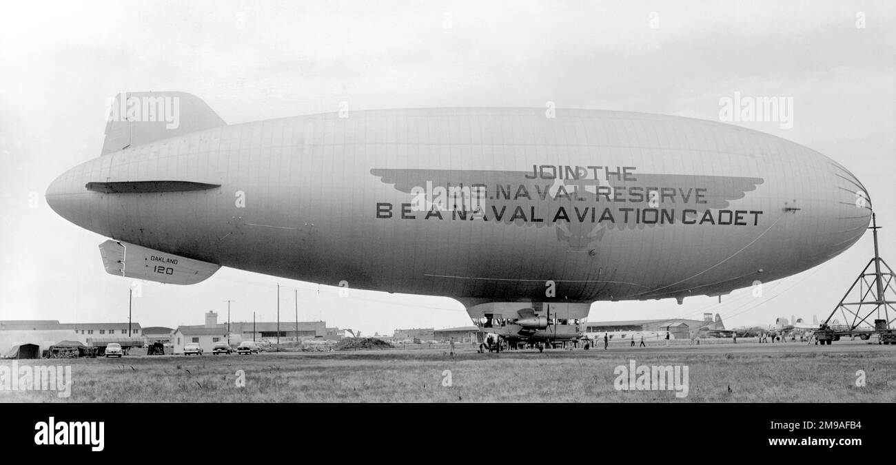 United States Navy - Goodyear ZSG-3 airship K-120 (BuAer number 33512), based at Oakland Naval Air Station in California, being used as a recruitment billboard for the US Naval Reserve. The K-class blimps originated in 1931 as the USN's first blimp with the car attached to the envelope, as opposed to suspended from cables. Given a variety of designations, with modifications and design changes, this particular K-class started life ca1940 as a ZNPK-3 (Z=airship, N=non-rigid, P=Patrol, K=K-class), the N (for non-rigid) was dropped in 1947 and re-designated again in 1954 as a ZSG-3 (Z=airship, S Stock Photo