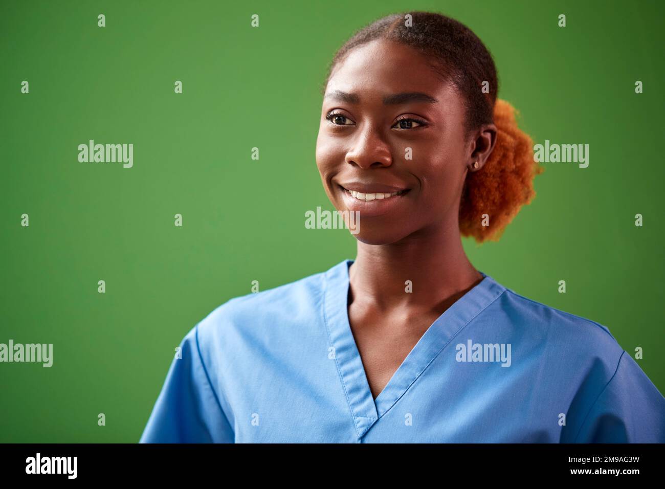 Portrait Of Female Nurse Or Doctor Wearing Scrubs Against Green Screen ...