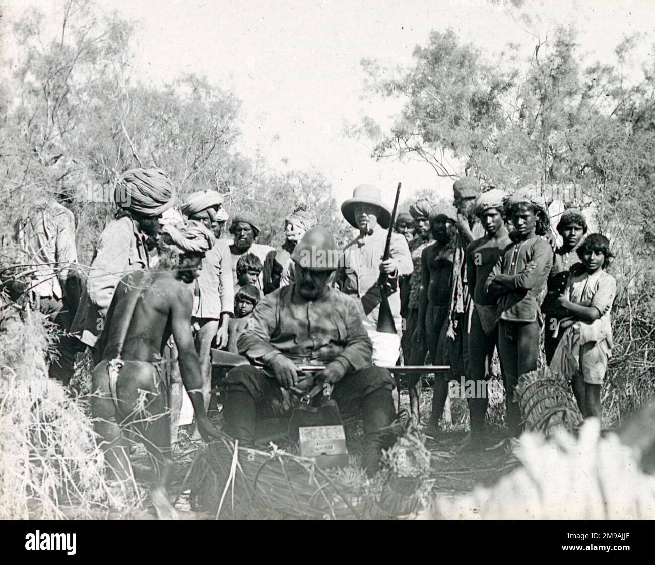 Colonial hunting party in India, setting out in reed boats.